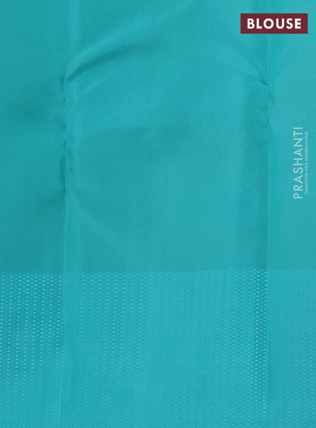 Kanchipuram silk saree grey and teal blue with allover self emboss and copper zari woven butta border