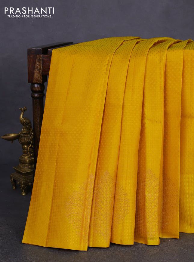 Kanchipuram silk saree mustard yellow and teal blue with allover self emboss and copper zari woven butta border