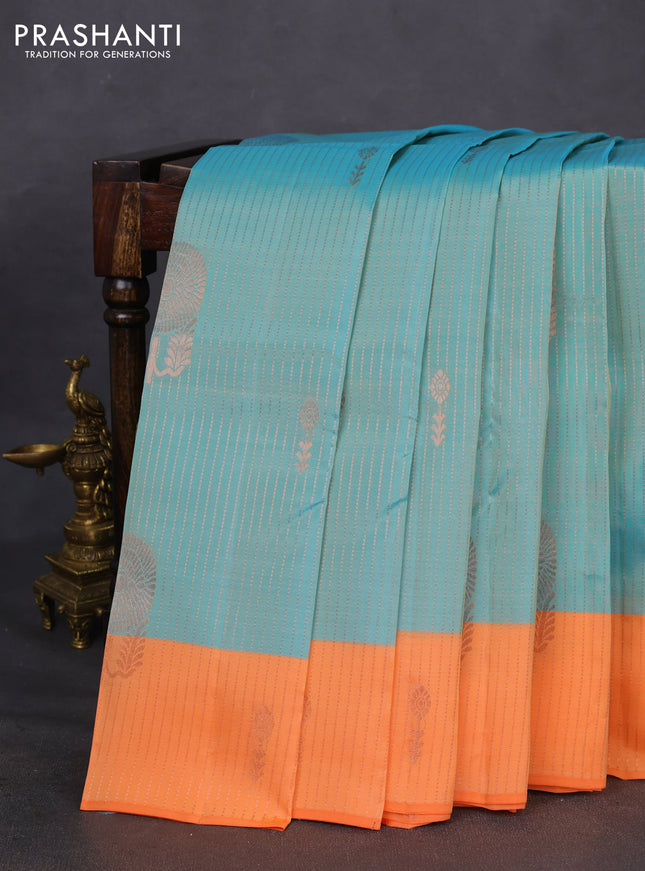 Kanchipuram silk saree dual shade of teal blue and orange with allover copper zari weaves and copper zari woven border