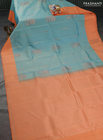 Kanchipuram silk saree dual shade of teal blue and orange with allover copper zari weaves and copper zari woven border