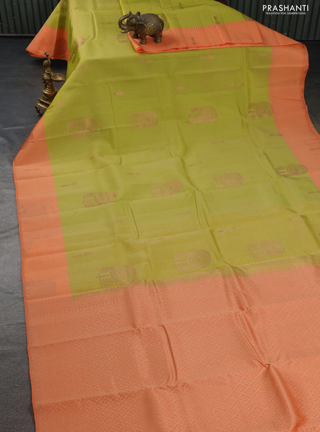Kanchipuram silk saree lime yellow and orange with allover copper zari weaves and copper zari woven border