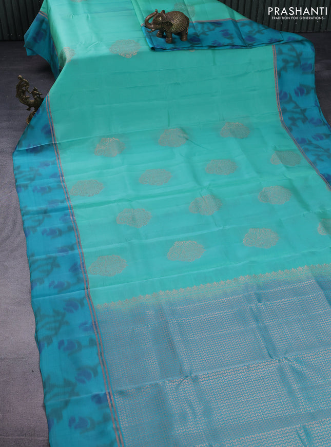 Kanchipuram silk saree teal green shade and teal blue with copper zari weaves & buttas and copper zari woven ikat style border