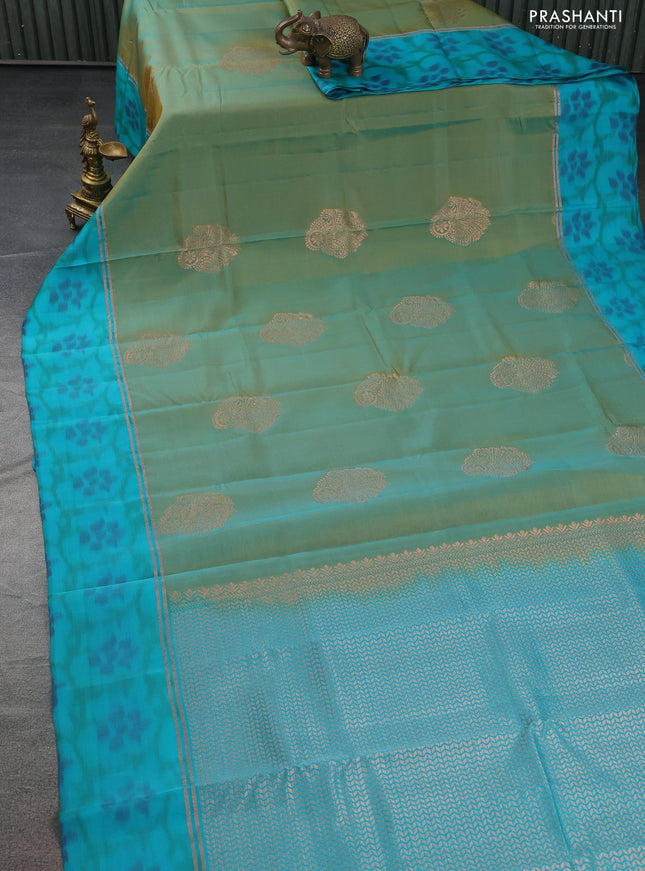 Kanchipuram silk saree dual shade of teal bluish mustard and teal blue shade with copper zari woven buttas and copper zari woven ikat style border