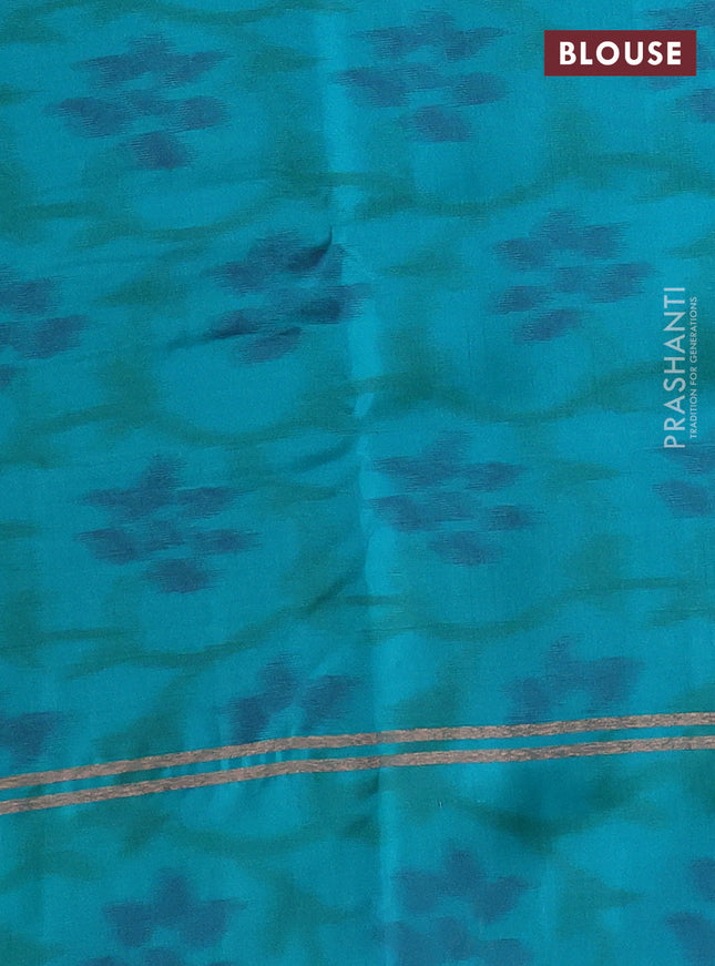 Kanchipuram silk saree dual shade of teal bluish mustard and teal blue shade with copper zari woven buttas and copper zari woven ikat style border