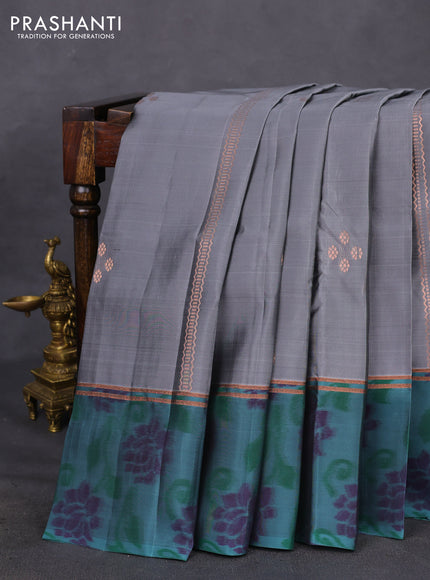 Kanchipuram silk saree grey and pastel green shade with copper zari weaves & buttas and copper zari woven ikat style border