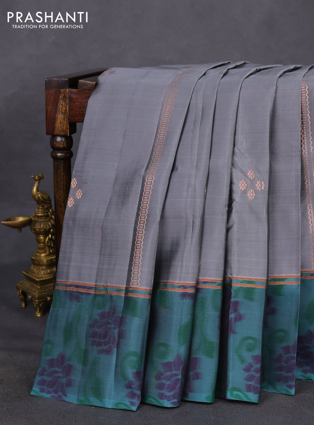 Kanchipuram silk saree grey and pastel green shade with copper zari weaves & buttas and copper zari woven ikat style border