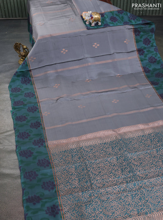Kanchipuram silk saree grey and pastel green shade with copper zari weaves & buttas and copper zari woven ikat style border