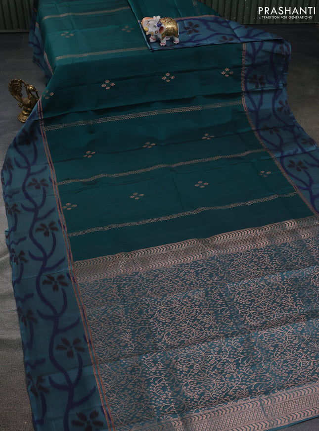 Kanchipuram silk saree peacock green and pastel blue with copper zari weaves & buttas and copper zari woven ikat style border
