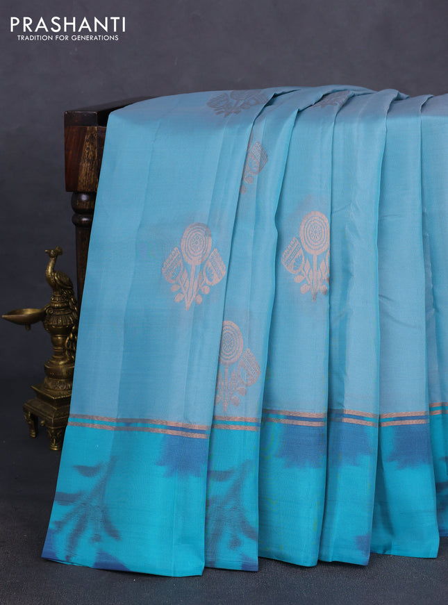 Kanchipuram silk saree pastel blue and teal green shade with copper zari woven buttas and copper zari woven ikat style border