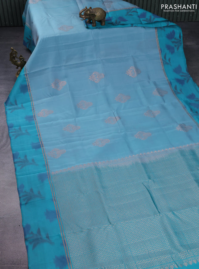Kanchipuram silk saree pastel blue and teal green shade with copper zari woven buttas and copper zari woven ikat style border