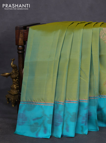 Kanchipuram silk saree dual shade of green and teal green with copper zari woven buttas and copper zari woven ikat style border
