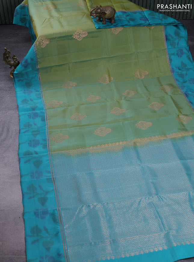 Kanchipuram silk saree dual shade of green and teal green with copper zari woven buttas and copper zari woven ikat style border