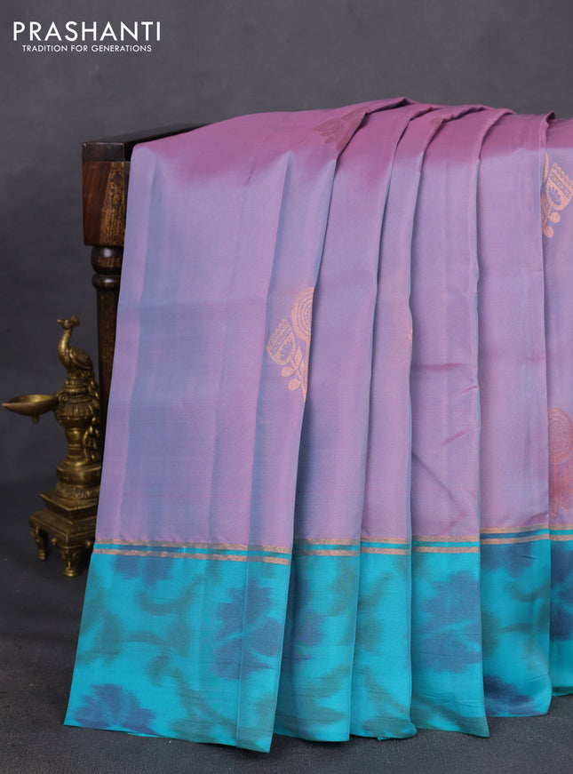 Kanchipuram silk saree dual shade of lavender and teal green with copper zari woven buttas and copper zari woven ikat style border