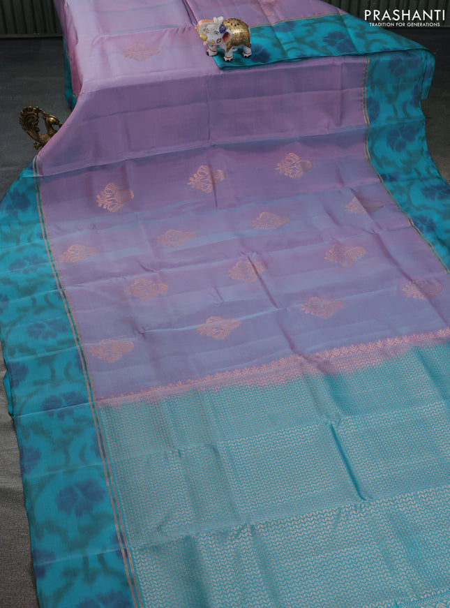 Kanchipuram silk saree dual shade of lavender and teal green with copper zari woven buttas and copper zari woven ikat style border