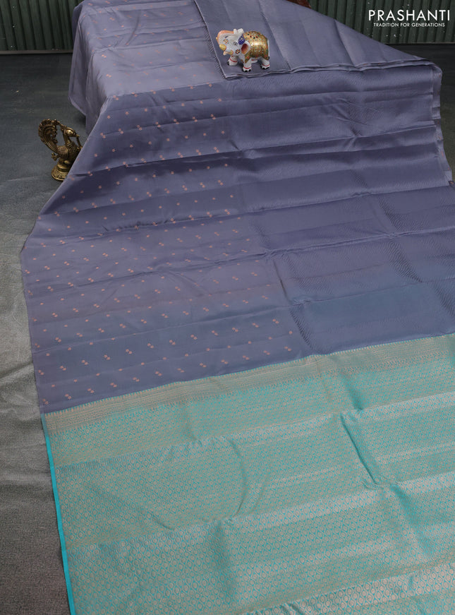 Kanchipuram silk saree grey and teal green shade with half & half style and long zari woven butta border