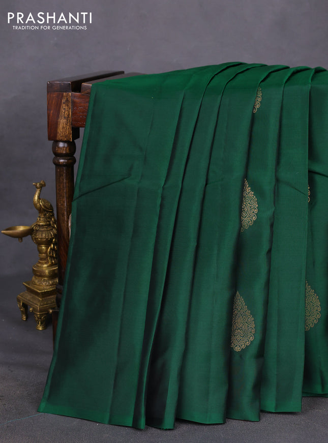 Kanchipuram silk saree green and dual shade of pinkish orange with copper zari woven buttas in borderless style