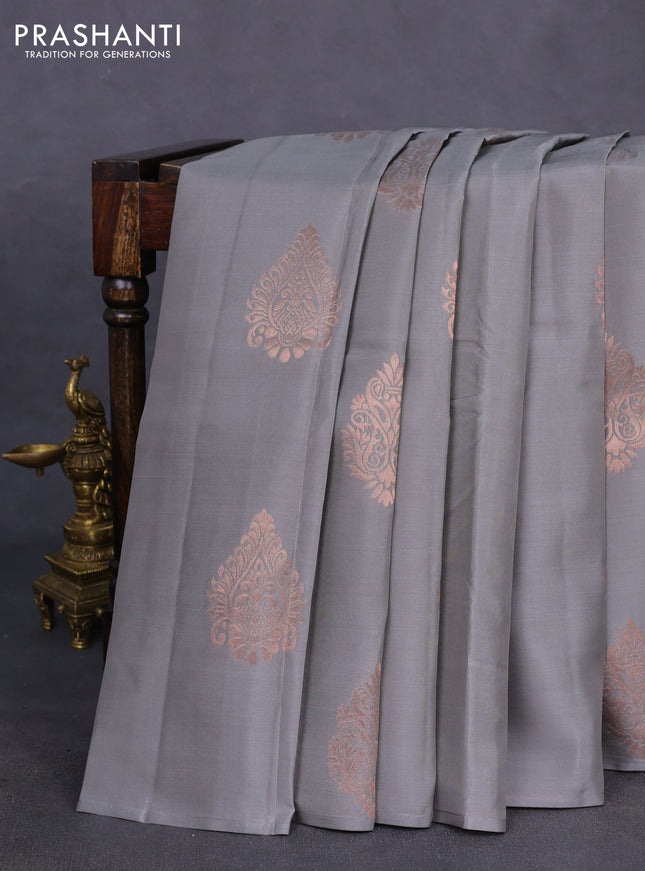 Kanchipuram silk saree grey and dual shade of pinkish orange with copper zari woven buttas in borderless style