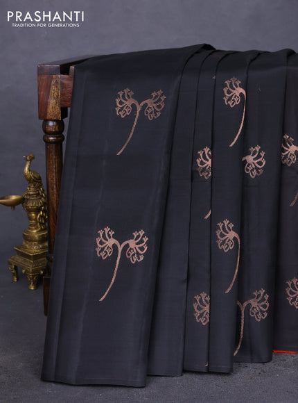 Kanchipuram silk saree black and pinkish orange with copper zari woven buttas in borderless style