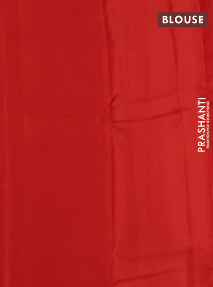 Kanchipuram silk saree black and pinkish orange with copper zari woven buttas in borderless style