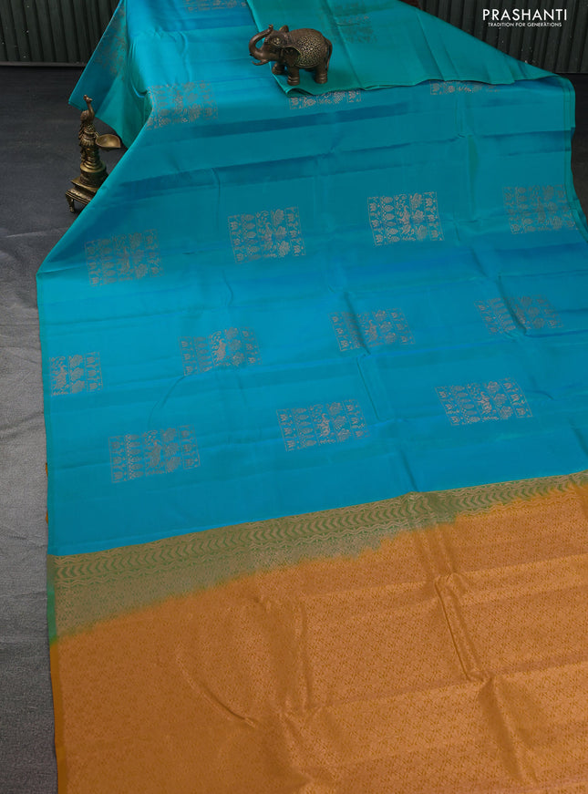 Kanchipuram silk saree dual shade of teal greenish blue and mustard yellow with copper zari woven buttas in borderless style