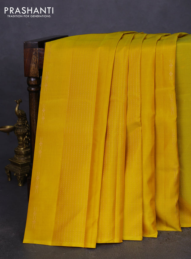 Kanchipuram silk saree yellow and teal green with allover copper zari weaves & buttas in borderless style