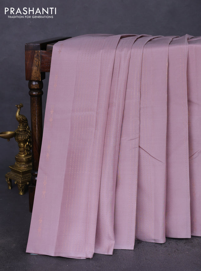 Kanchipuram silk saree pastel pink and teal green with allover copper zari weaves & buttas in borderless style