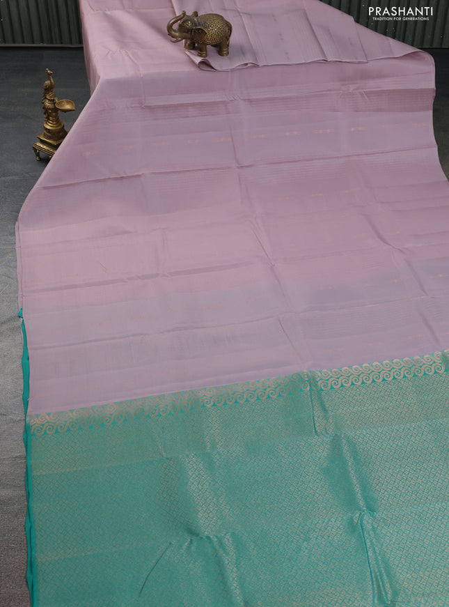 Kanchipuram silk saree pastel pink and teal green with allover copper zari weaves & buttas in borderless style