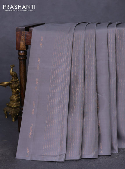 Kanchipuram silk saree grey and teal green with allover copper zari weaves & buttas in borderless style