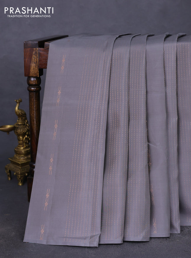 Kanchipuram silk saree grey and teal green with allover copper zari weaves & buttas in borderless style