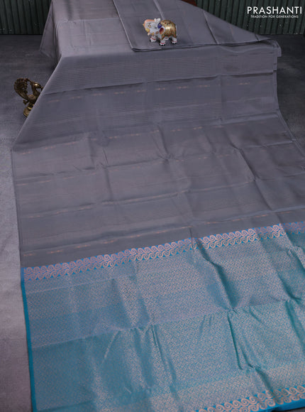 Kanchipuram silk saree grey and teal green with allover copper zari weaves & buttas in borderless style
