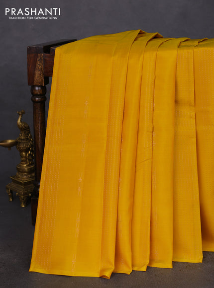 Kanchipuram silk saree yellow and teal green with allover copper zari weaves & buttas in borderless style