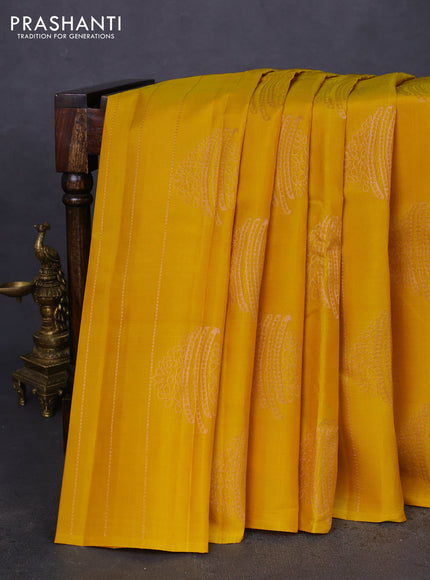 Kanchipuram silk saree mustard yellow and teal blue with allover copper zari weaves in borderless style