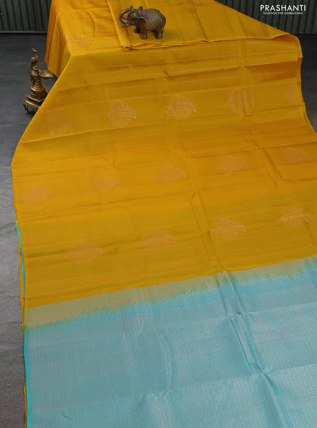 Kanchipuram silk saree mustard yellow and teal blue with allover copper zari weaves in borderless style