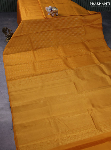 Kanchipuram silk saree mustard yellow with allover zari weaves in borderless style