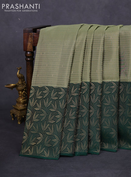 Kanchipuram soft silk saree pastel green and green with allover zari weaves and rich zari woven border