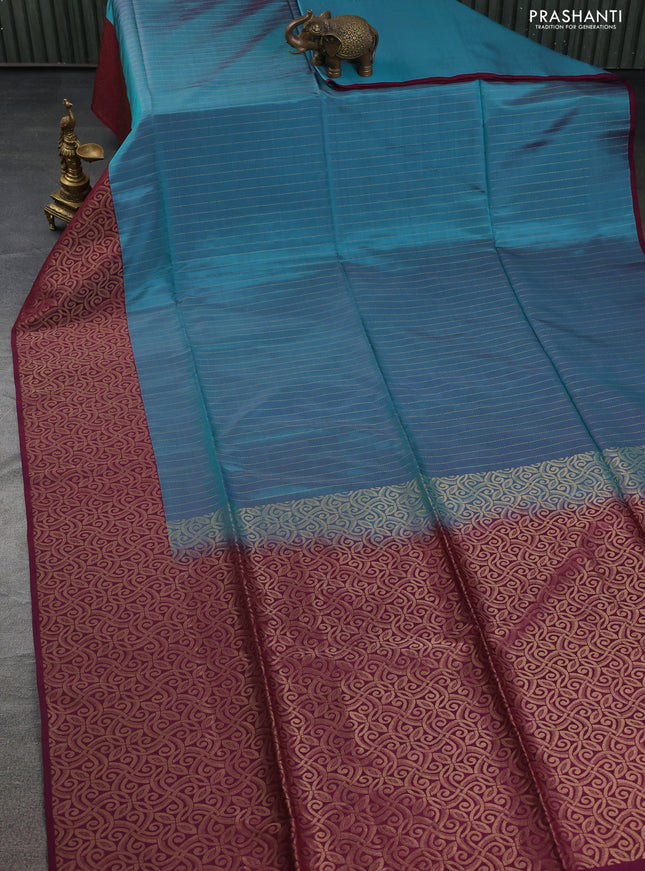 Kanchipuram soft silk saree dual shade of teal green and wine shade with allover zari weaves in borderless style