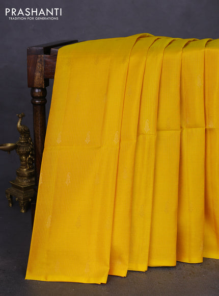 Kanchipuram soft silk saree yellow and pastel green with allover zari weaves in borderless style