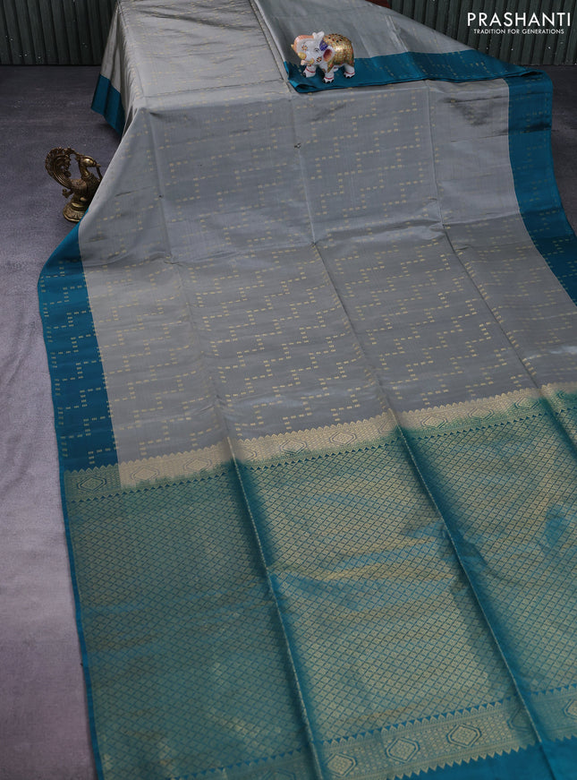 Kanchipuram soft silk saree grey and teal blue with allover zari weaves and zari woven border