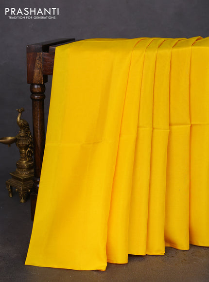 Kanchipuram soft silk saree yellow and pink with plain body in borderless style