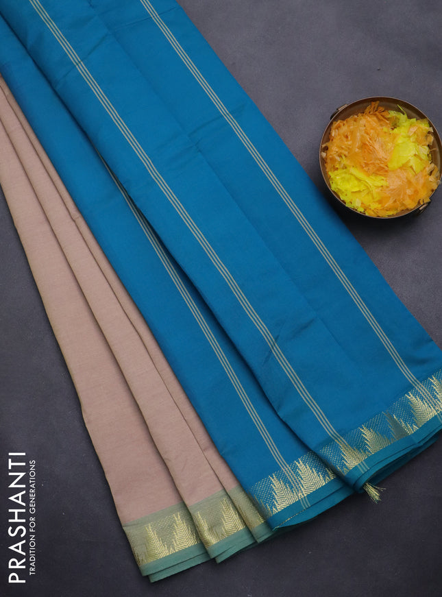 Semi silk cotton saree dual shade of beige and cs blue with plain body and zari woven border