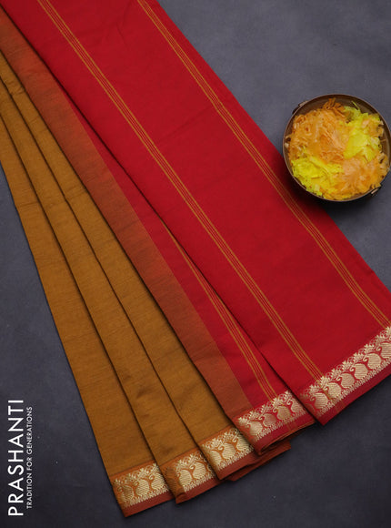 Semi silk cotton saree dark mustard and red with plain body and zari woven border
