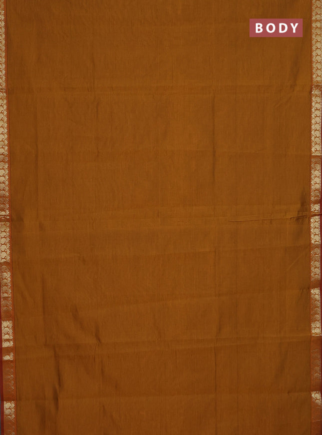 Semi silk cotton saree dark mustard and red with plain body and zari woven border