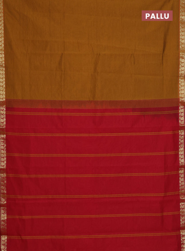 Semi silk cotton saree dark mustard and red with plain body and zari woven border
