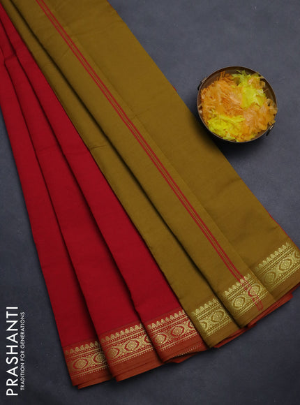 Semi silk cotton saree red and dark mustrad with plain body and zari woven border