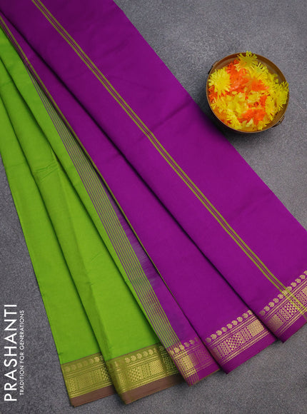 Semi silk cotton saree light green and purple with plain body and zari woven border