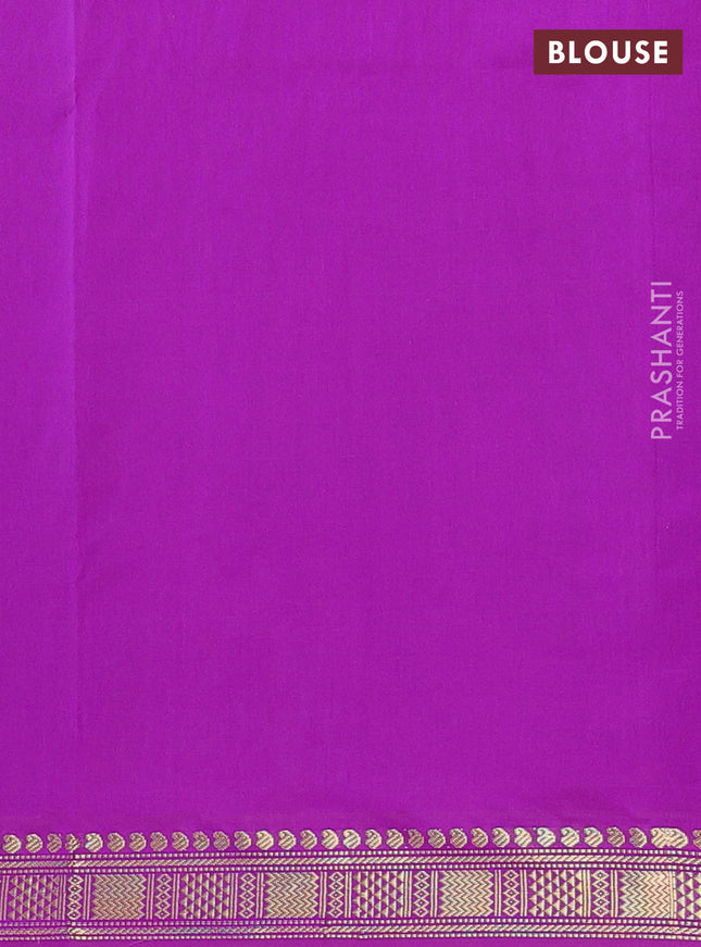 Semi silk cotton saree light green and purple with plain body and zari woven border