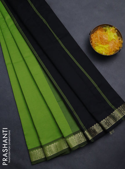 Semi silk cotton saree green and black with plain body and zari woven border