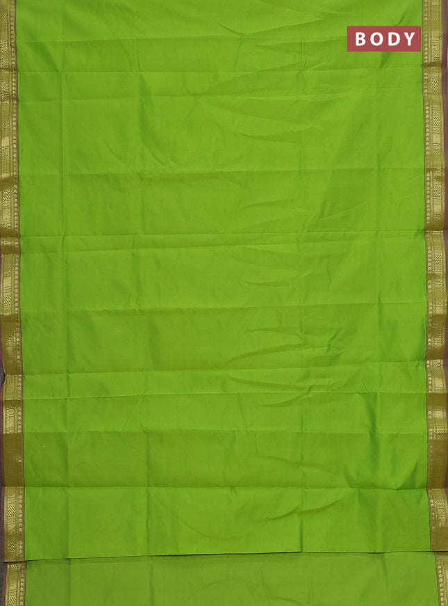 Semi silk cotton saree green and black with plain body and zari woven border