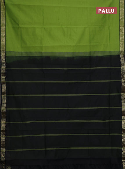 Semi silk cotton saree green and black with plain body and zari woven border