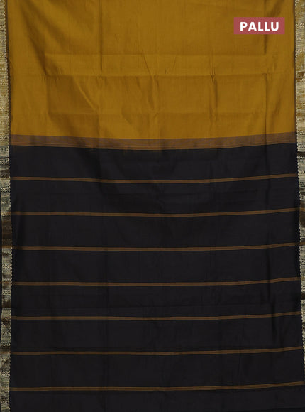 Semi silk cotton saree dark mustard and black with plain body and zari woven border